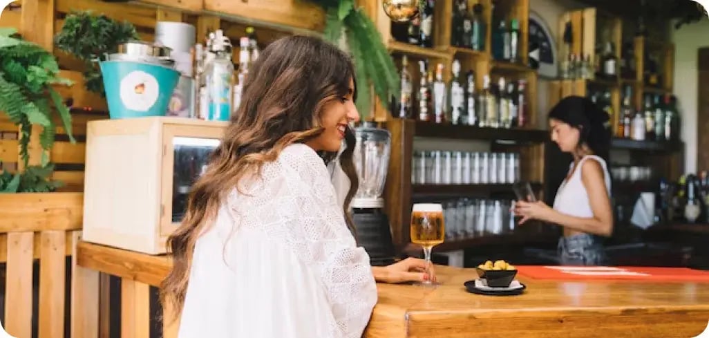 Woman Ordering a Drink