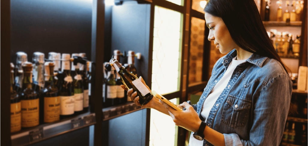 Woman Reading a Bottle